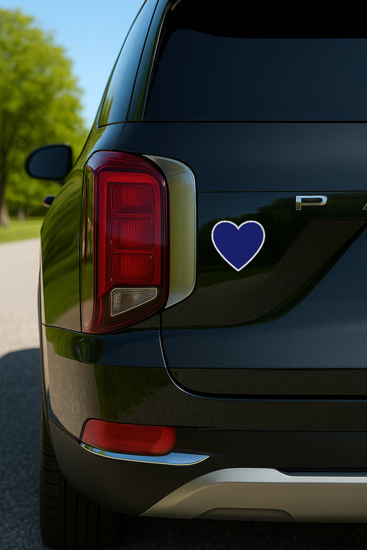 'Blue Heart for Democratic Support' magnet or vinyl decal displayed on the back of a black SUV. A bold, high-quality political sticker perfect for cars, laptops, fridges, or toolboxes. Great for activists, protestors, or anyone fed up with fascism.