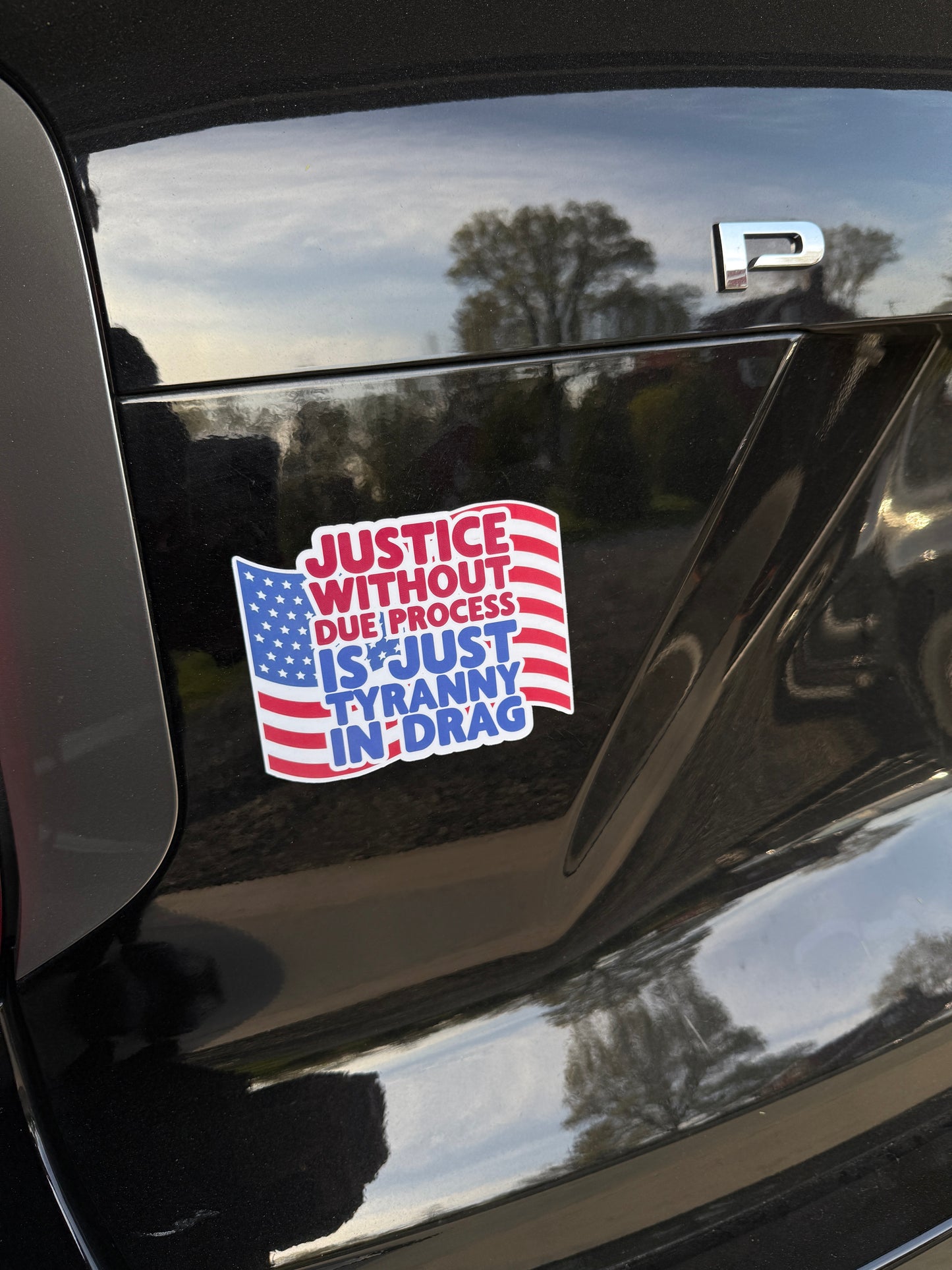Justice without due process is just tyranny in drag magnet displayed on a car, warning against authoritarian abuse of power.