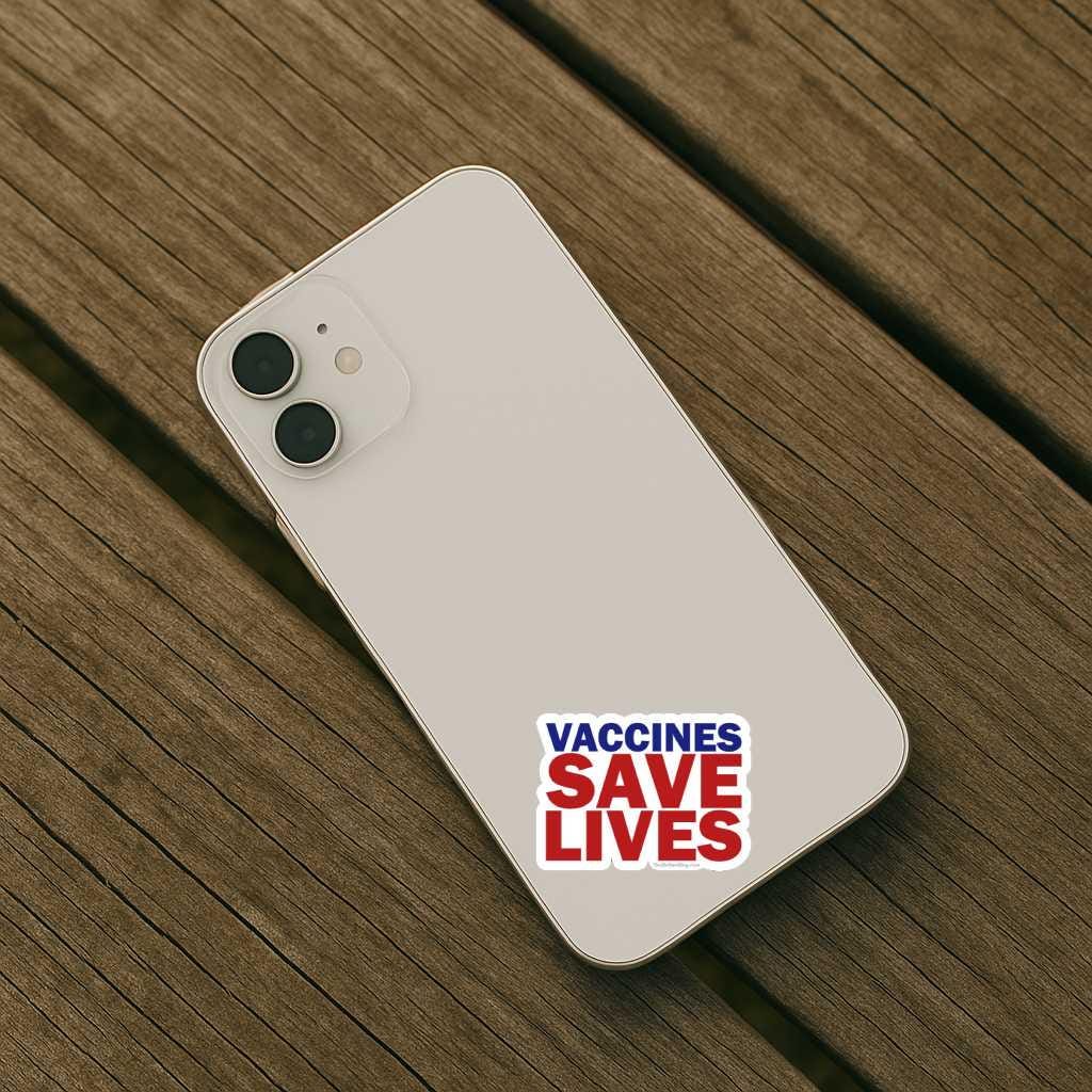 Phone with 'Vaccines Save Lives' sticker on a wooden surface