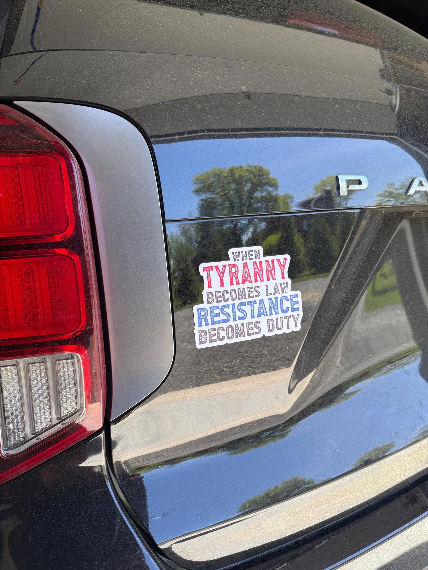 A bold magnet or vinyl decal that reads “When Tyranny Becomes Law, Resistance Becomes Duty” in striking, attention-grabbing font.