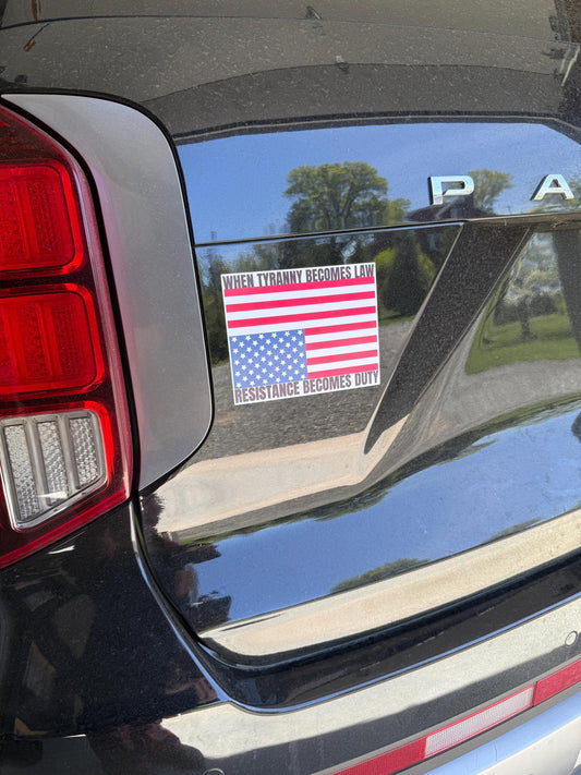 A vinyl decal or magnet displaying the phrase "When tyranny becomes law, resistance becomes duty" in bold lettering, accompanied by an upside-down American flag—a symbol of distress. The design conveys a strong political message about civil resistance.