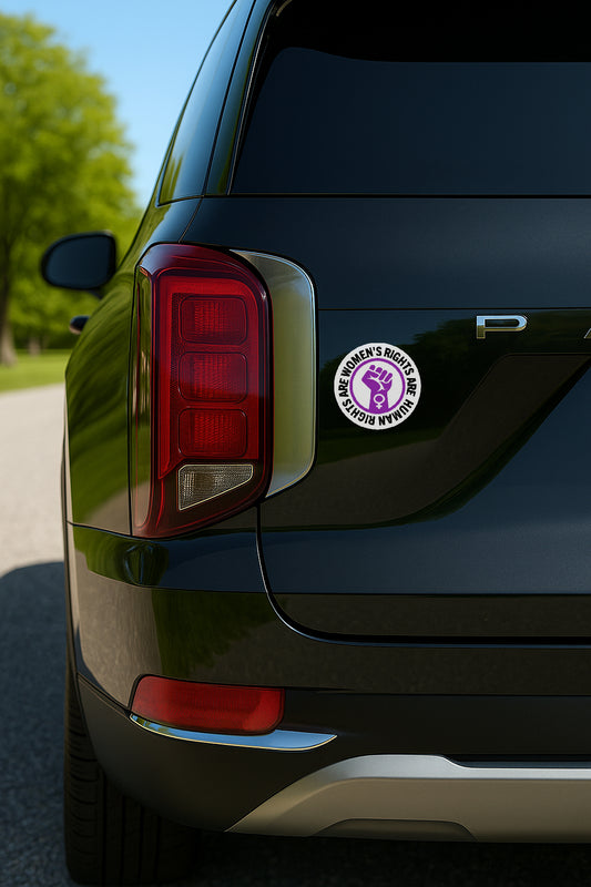 'Women's Rights Are Human Rights' magnet or vinyl decal displayed on the back of a black SUV. A bold, high-quality political sticker perfect for cars, laptops, fridges, or toolboxes. Great for activists, protestors, or anyone fed up with fascism.