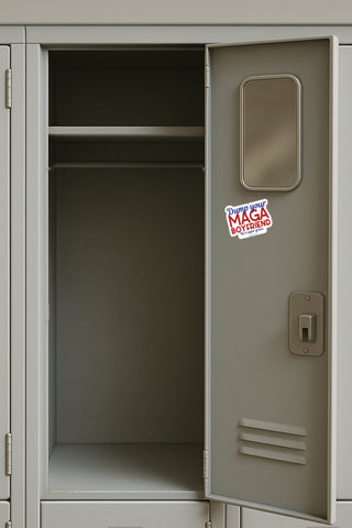 Open gray locker with a 'dump your MAGA Boyfriend' sticker on the door.