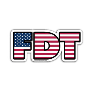 FDT sticker design in bold block letters filled with the American flag pattern on a white background with subtle drop shadow.