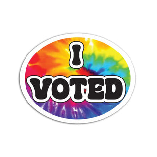 An oval sticker with a vibrant rainbow tie-dye background and the text 'I VOTED' in bold black letters with a white outline, centered on a plain white background.