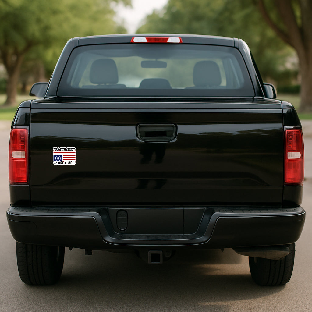'I Do Not Stand with Trump' magnet or vinyl decal displayed on the tailgate of a black pickup truck. A bold, high-quality political sticker perfect for cars, laptops, fridges, or toolboxes. Great for activists, protestors, or anyone fed up with fascism.