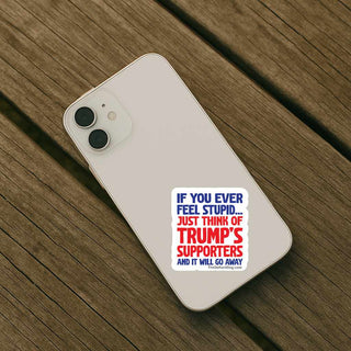 Phone case with a political message on a wooden surface
