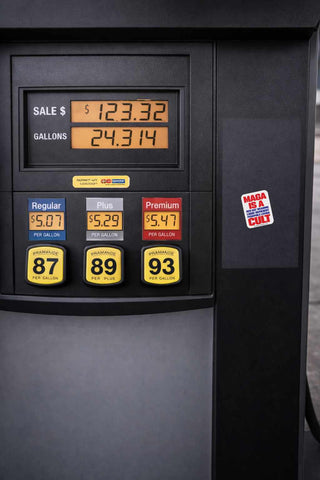 Sticker with text 'MAGA is a red hat wearing logic deficient pedophile loving cult' on a Fuel pump display with fuel prices and quantities