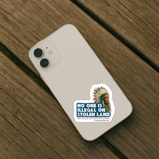 Phone case with a sticker on a wooden surface