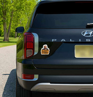 Black Hyundai Palisade with a 'Sleepy Donny' sticker on the back