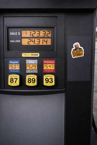 Fuel pump display with price and quantity information, featuring a 'Sleepy Donny' sticker.