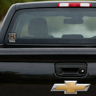 Anti Trump veteran sticker skull helmet American flag decal on black Chevy Silverado truck tailgate