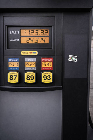 Zionism Is Racism political sticker displayed on black gas pump