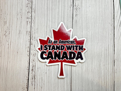 As an American, I Stand With Trump magnet in white text displayed on a table as a liberal political statement