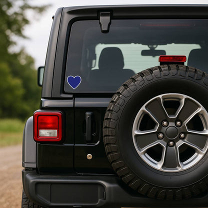 Black SUV with a blue heart sticker on the rear window, parked outdoors.