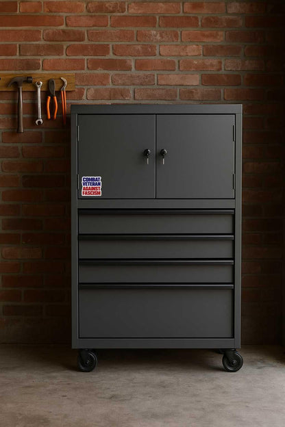 Gray tool cabinet with combat-veteran-against-fascism-sticker- multiple drawers against a brick wall.