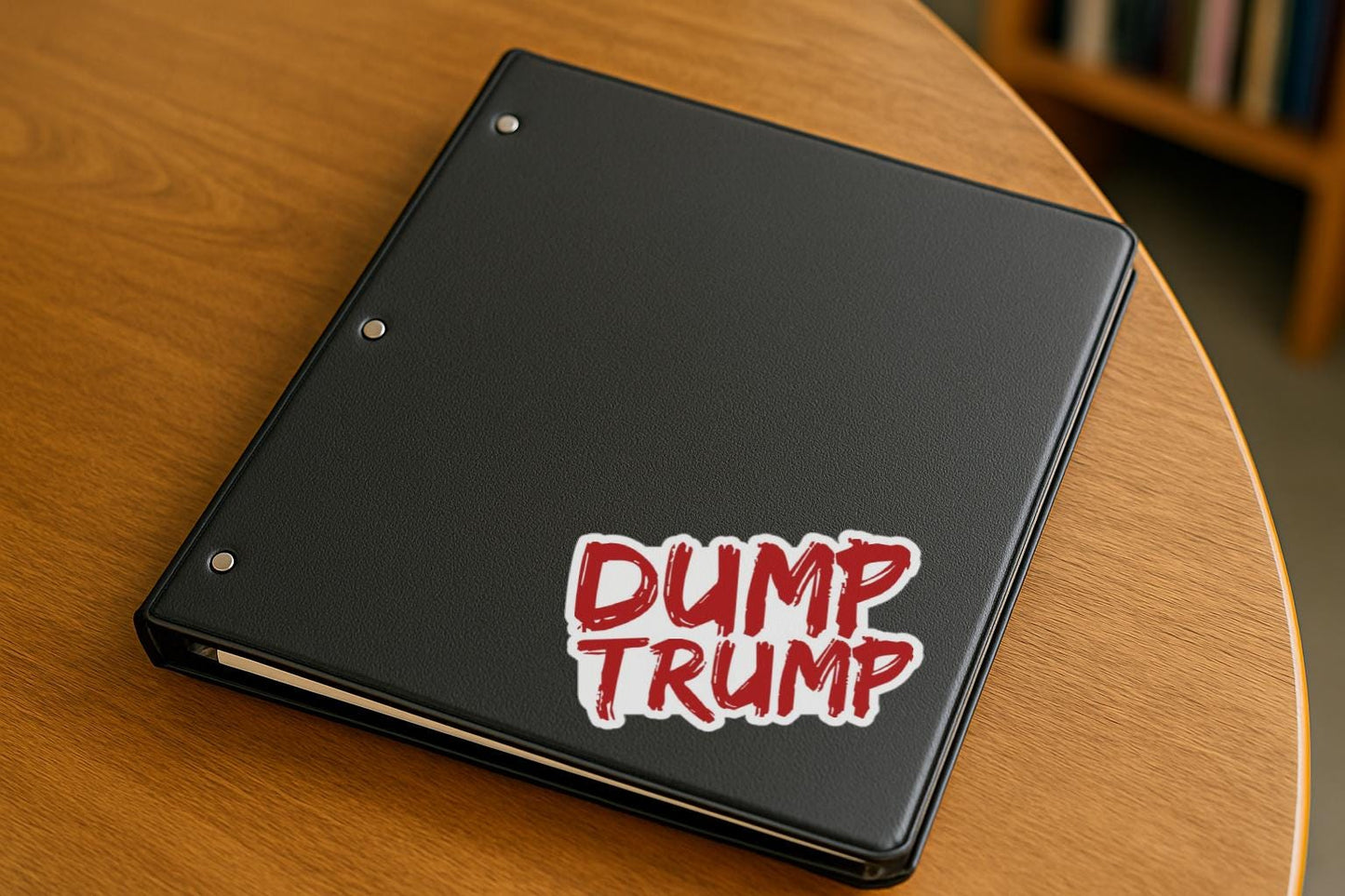 Bold red graffiti-style text that says “Dump Trump”—a rebellious magnet or decal for progressive voters and anti-Trump activists.