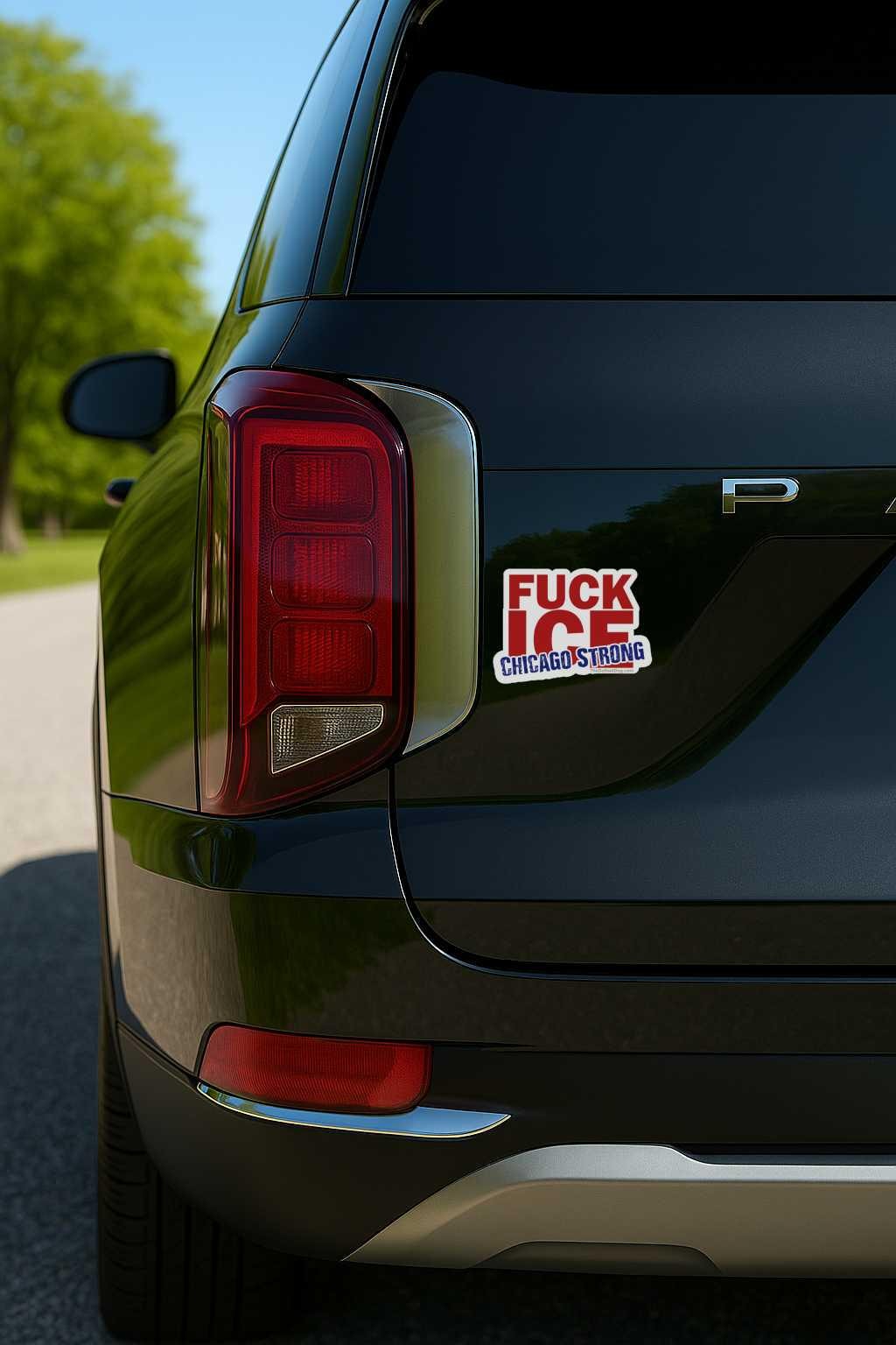 Car with a sticker on the back window, featuring text and graphics.
