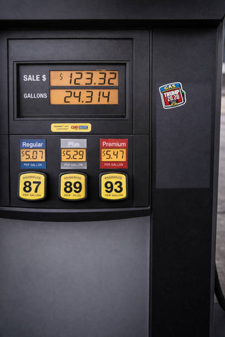 realistic gas pump display with political parody sticker applied showing fuel price style design with trump 2028 text