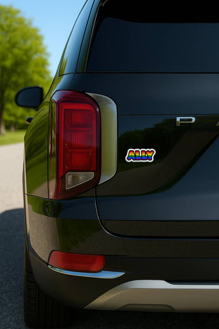 Back of a black car with a colorful 'ALLY' logo on the trunk.