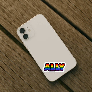 Phone case with 'ALLY' sticker on a wooden surface