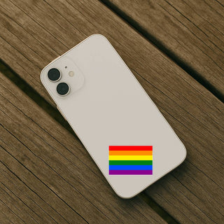 Phone case with a rainbow flag design on a wooden surface