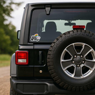 Black SUV with a tire and a visible sticker on the back window.