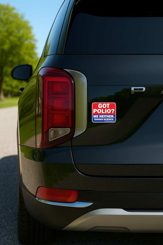 A close-up rear view of a black SUV showing a red and blue 'GOT POLIO? ME NEITHER.' sticker applied to the quarter panel near the taillight.