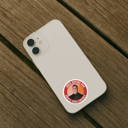 Phone case with a sticker of a person and text on a wooden surface