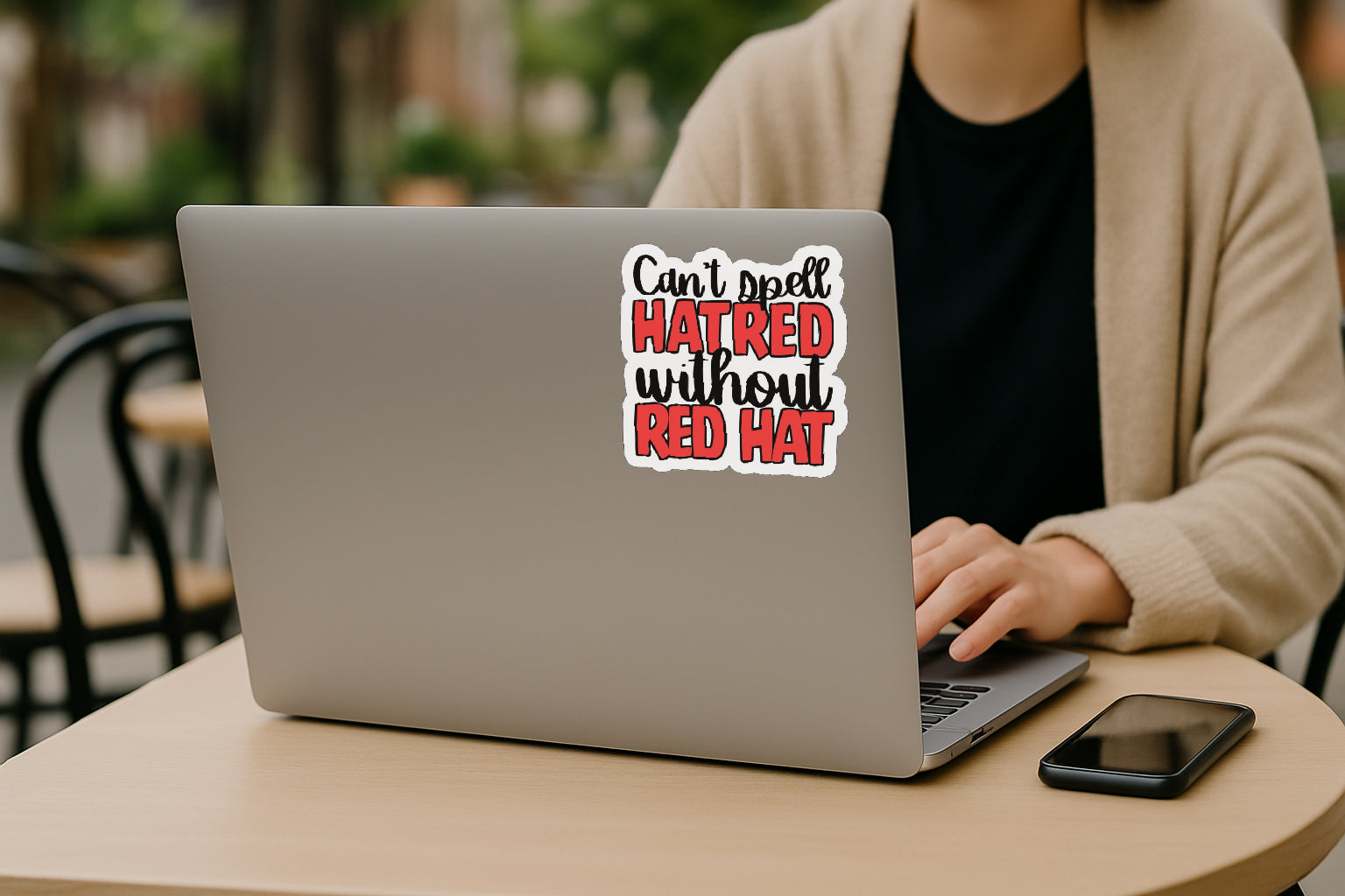 'Can't Spell Hatred Without Red Hat' magnet or vinyl decal displayed on the back of a laptop. A bold, high-quality political sticker perfect for cars, laptops, fridges, or toolboxes. Great for activists, protestors, or anyone fed up with fascism.