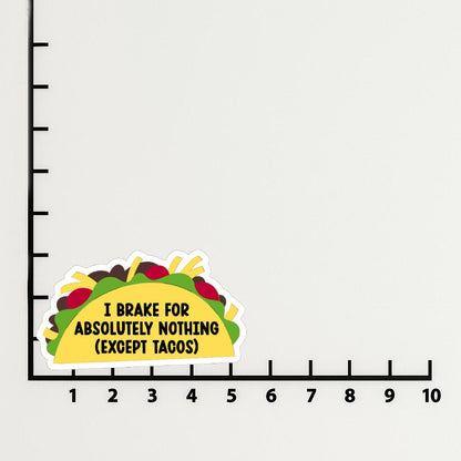 'I Brake for Absolutely Nothing Except Tacos' magnet or vinyl decal displayed with a slight shadow on a white background. A bold, high-quality political sticker perfect for cars, laptops, fridges, or toolboxes. Great for activists, protestors, or anyone fed up with fascism.
