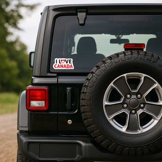 Black Jeep with a sticker on the rear window outdoors