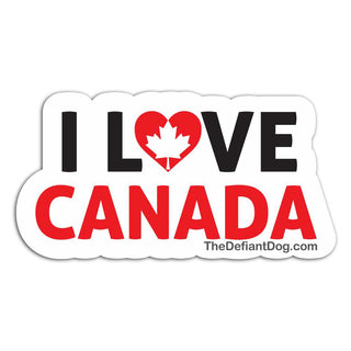 A die-cut sticker with the text 'I LOVE CANADA' in black and red, with a red heart shaped like a Canadian maple leaf in the center. Small text at the bottom reads 'TheDefiantDog.