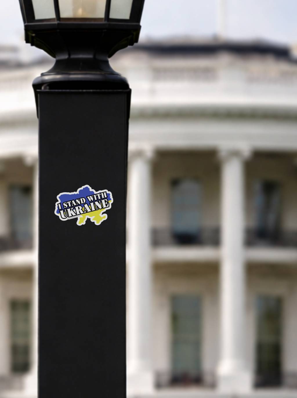 I Stand With Ukraine vinyl sticker on black lamp post with White House background, Ukraine flag country shape decal, pro Ukraine political bumper sticker, support Ukraine waterproof outdoor activist sticker
