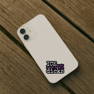 White smartphone with a sticker on a wooden surface
