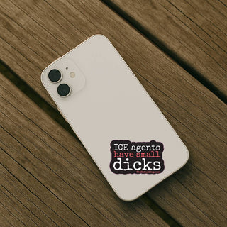 Phone with a sticker on a wooden surface