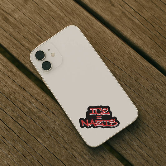 White phone case with 'Ice = Nazis' design on a wooden surface