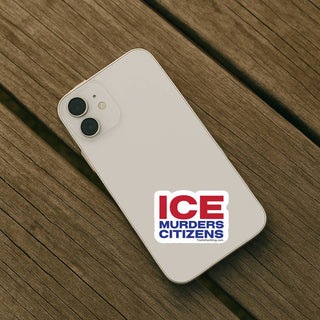 Phone with a sticker on a wooden surface
