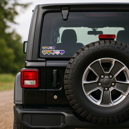Black Jeep with rainbow heart sticker on rear window