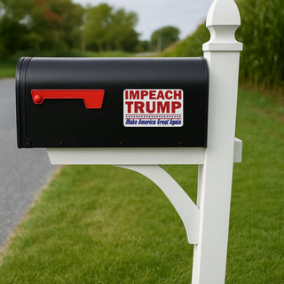 Black mailbox with 'IMPEACH TRUMP' sticker on a white post outdoors.
