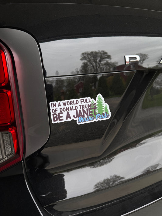 In a world of Donald Trumps, be a Janet. Maine pride magnet displayed on a car celebrating progressive leadership and local pride.