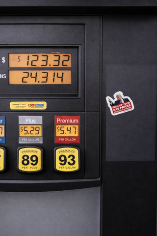 Anti Trump gas prices sticker placed on gas pump showing high fuel prices over five dollars per gallon political satire vinyl decal in public setting