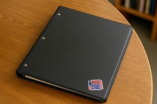 Justice Without Due Process Is Just Tyranny In Drag die cut sticker applied to the corner of a black binder on a wooden table.