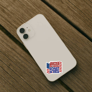 Justice Without Due Process Is Just Tyranny In Drag sticker applied to the back of a light colored smartphone on a wooden surface.