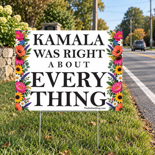 Kamala Was Right About Everything political lawn sign with colorful flowers displayed beside a neighborhood road.