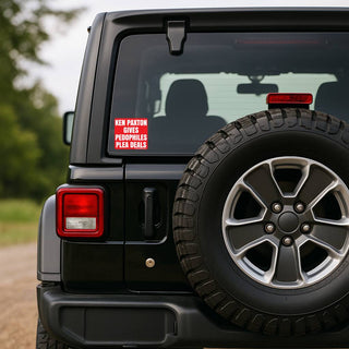 Black Jeep Wrangler with spare tire on a dirt road