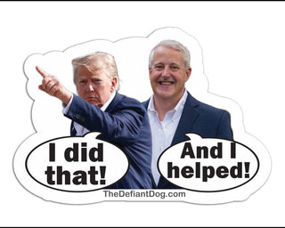 A die-cut sticker featuring a composite photo of Donald Trump pointing and Michael Whatley smiling, with speech bubbles reading 'I did that!' and 'And I helped!'. The sticker includes the website text 'TheDefiantDog.