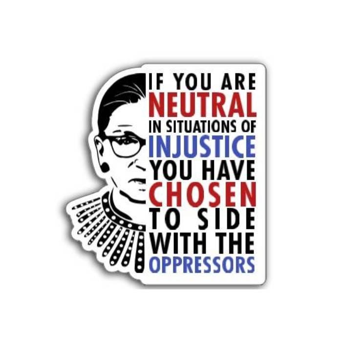 If you are neutral in situations of injustice, you have chosen to side with the oppressor magnet displayed on a table promoting action over silence.
