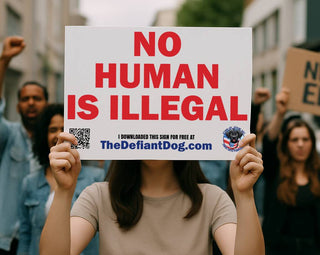 Person holding a 'No Human is Illegal' sign with a QR code at a protest.