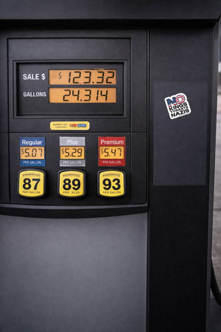 Fuel pump display with prices and options on a black background